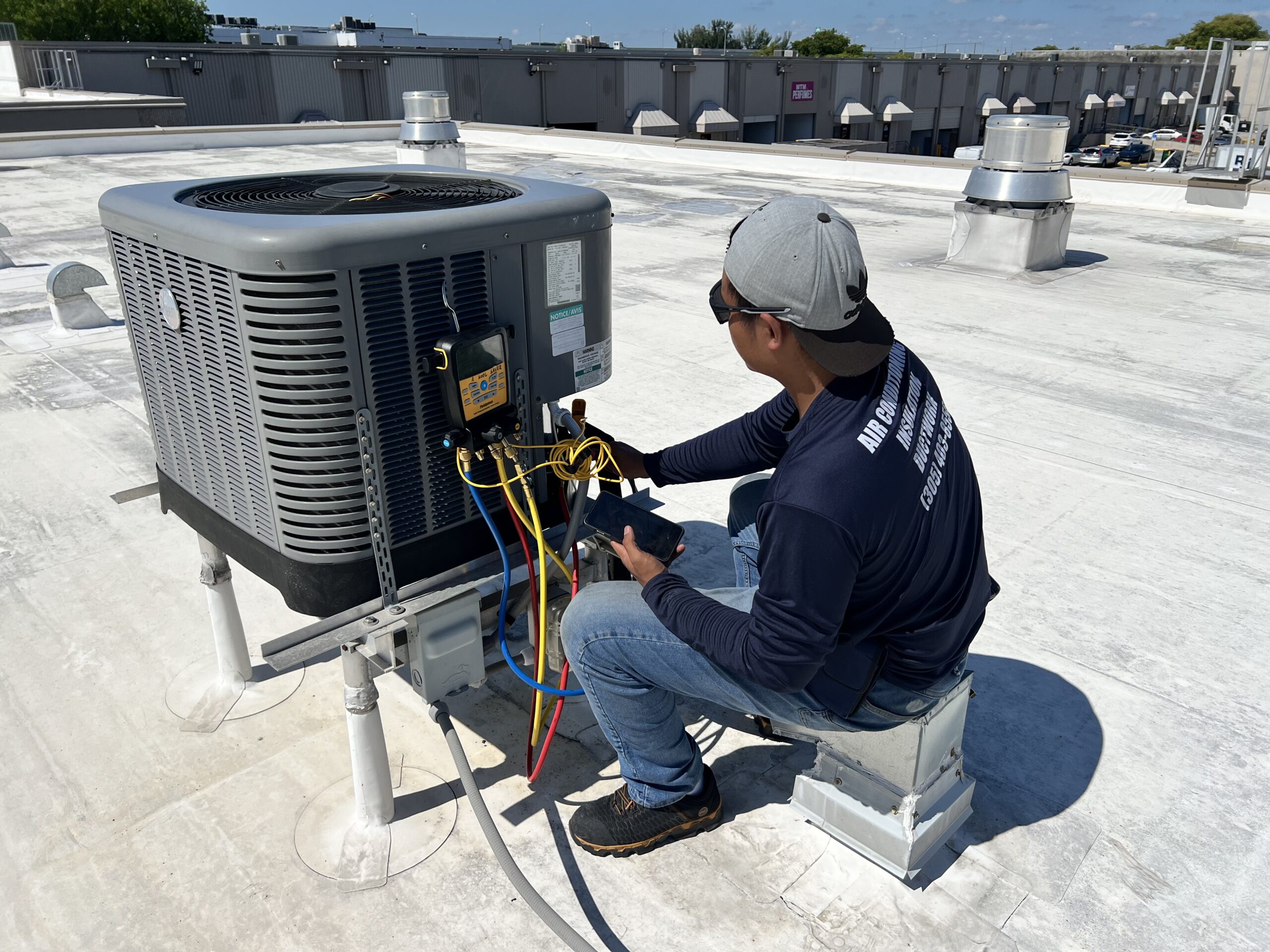 AKS technician diagnosing AC unit